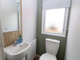 A bathroom with a sink and a toilet at Haven Seashore, Ellerton Willerby Xtra in Great Yarmouth