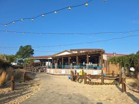An outdoor seating area with a bar and plants at Haven Seashore, Ellerton Willerby Xtra, Great Yarmouth