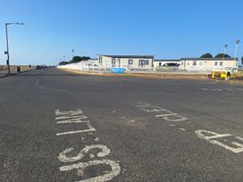A street with caravan homes and road markings at Haven Seashore, Great Yarmouth