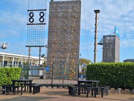 An outdoor climbing wall and benches at Haven Seashore, Ellerton Willerby Xtra in Great Yarmouth