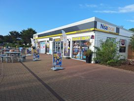 An outdoor view of a bakery and beach shop at Haven Seashore, Ellerton Willerby Xtra in Great Yarmouth