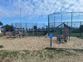 A playground with a sandbox and play equipment at Haven Seashore, Ellerton Willerby Xtra Great Yarmouth