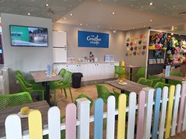 A creative studio with tables and green chairs at Haven Seashore, Ellerton Willerby Xtra, Great Yarmouth