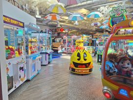 A game area with arcade games and claw machines at Haven Seashore, Ellerton Willerby Xtra, Great Yarmouth