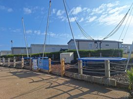 An outdoor area with a trampoline and caravans at Haven Seashore, Great Yarmouth