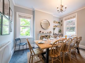 A dining room with a table set for a meal at 59 Garfield Road, Scarborough