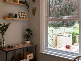 A kitchen with shelves and a view of a garden at 59 Garfield Road, Scarborough
