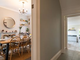 A dining room with a table set for dinner at 59 Garfield Road in Scarborough