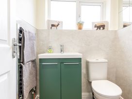 A bathroom with a sink and toilet at 59 Garfield Road in Scarborough