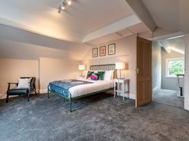 A bedroom with a bed and side tables at 59 Garfield Road Scarborough