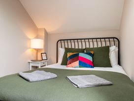 A bedroom with a bed and lamp at 59 Garfield Road Scarborough