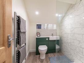 A bathroom with a toilet and sink at 59 Garfield Road Scarborough