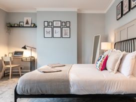 A bedroom with a bed and a desk at 59 Garfield Road, Scarborough