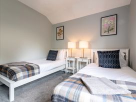 A bedroom with two beds and lamps at 59 Garfield Road, Scarborough