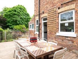A dining area with a table and chairs at 59 Garfield Road, Scarborough