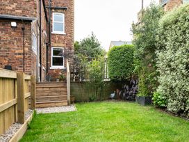 A garden with grass and plants at 59 Garfield Road, Scarborough