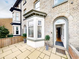 An outdoor area featuring a front door and window at 44 Norwood Street in Scarborough
