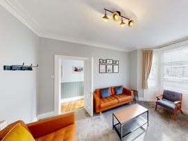 A living room with furniture and decor at 44 Norwood Street in Scarborough