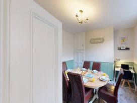 A dining room with a table and chairs at 44 Norwood Street Scarborough