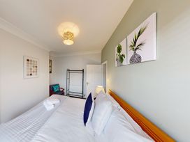A bedroom with bed and decorative elements at 44 Norwood Street Scarborough