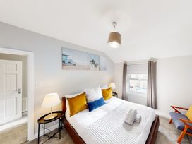 A bedroom with a bed and side tables at 44 Norwood Street Scarborough