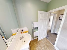 A bathroom with a sink and mirror at 44 Norwood Street Scarborough