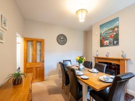 A dining room with a table and chairs at 18 Mayville Avenue, Scarborough