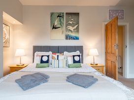 A bedroom featuring a bed with pillows and lamps at 18 Mayville Avenue in Scarborough