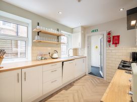 A kitchen with a sink and stove at 125 Columbus Ravine Scarborough