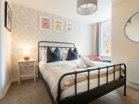 A bedroom with a bed and bedside table at 125 Columbus Ravine, Scarborough