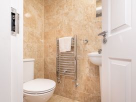 A bathroom with a toilet and sink at 125 Columbus Ravine Scarborough