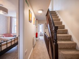 A hallway with a staircase and bed at 125 Columbus Ravine Scarborough