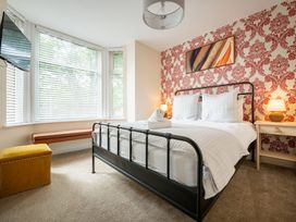 A bedroom with a bed and television at 125 Columbus Ravine in Scarborough