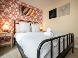 A bedroom with a bed and nightstand at 125 Columbus Ravine Scarborough