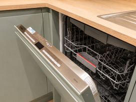 A dishwasher with open door and silver control panel at 125 Columbus Ravine in Scarborough