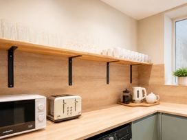 A kitchen with appliances and glassware at 125 Columbus Ravine in Scarborough