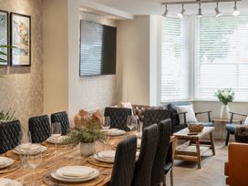 A dining room with a table set for dinner at 125 Columbus Ravine in Scarborough