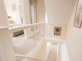 A hallway with a staircase and a mirror at 125 Columbus Ravine, Scarborough