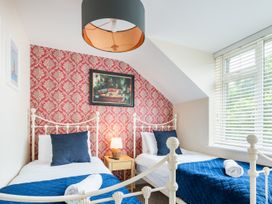A bedroom with two beds and a nightstand at 125 Columbus Ravine Scarborough