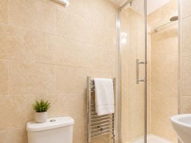 A bathroom with a shower and toilet at 125 Columbus Ravine Scarborough