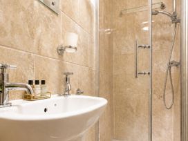A bathroom with a sink and shower at 125 Columbus Ravine in Scarborough