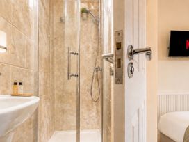 A bathroom with a shower and a sink at 125 Columbus Ravine in Scarborough