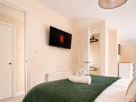 A bedroom with a bed and TV at 125 Columbus Ravine in Scarborough