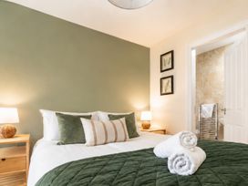 A bedroom with a bed and nightstand at 125 Columbus Ravine Scarborough