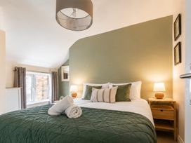 A bedroom with a bed and nightstand at 125 Columbus Ravine in Scarborough