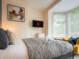 A bedroom with a bed and TV at 125 Columbus Ravine in Scarborough
