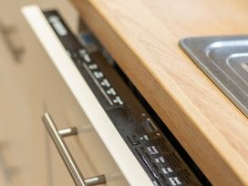 A kitchen with a dishwasher and sink at 125 Columbus Ravine in Scarborough
