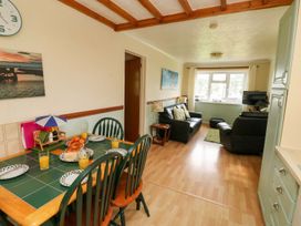A dining room with a table set for breakfast at Cottage 28 in Brixham