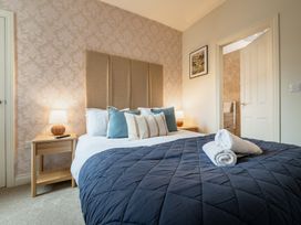 A bedroom with a bed and bedside table at 127 Columbus Ravine, Scarborough