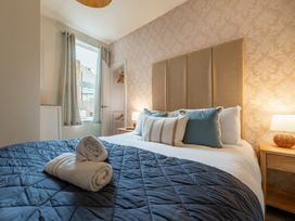 A bedroom with a bed and bedside table at 127 Columbus Ravine in Scarborough
